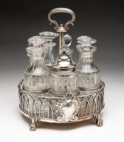 GEORGE III ENGLISH SILVER AND CRYSTAL CONDIMENT SET BY PAUL STORR (1770-1844).