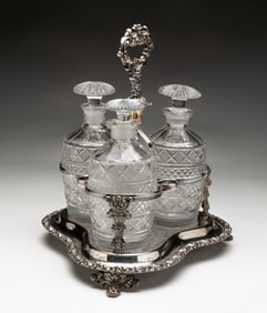 ENGLISH SILVER PLATED AND CRYSTAL TANTALUS.