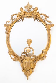 BAROQUE MIRROR SCONCE WITH PUTTI.