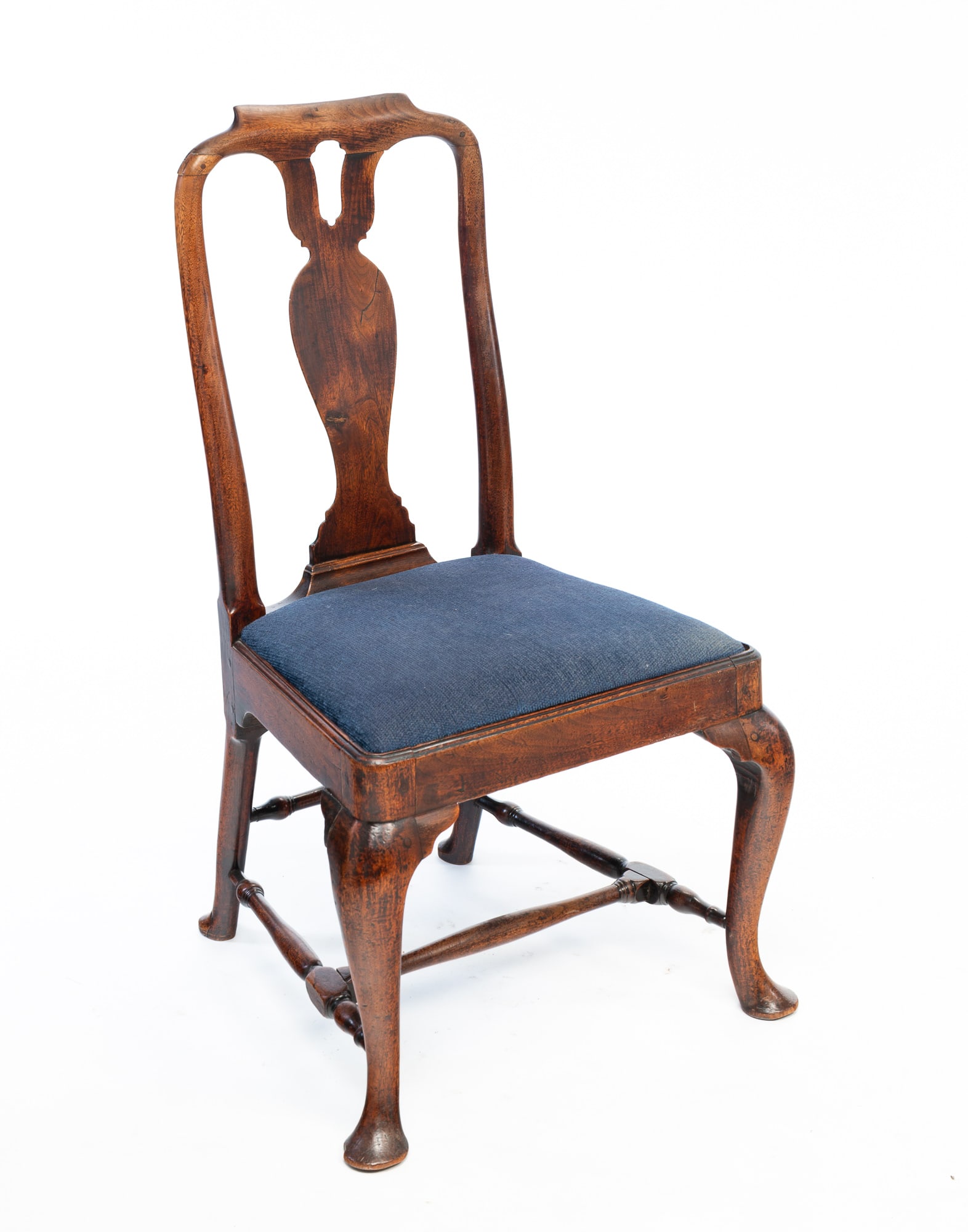 QUEEN ANNE SIDE CHAIR.: England, 18th Century. Mahogany. Pegged construction. Shaped crest, pierced carved vase shaped splat, turned rungs with "H" shaped stretcher and cabriole legs with pad feet. 17" seat. 37.5"h.