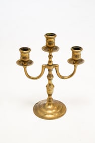 EARLY DIMINUTIVE BRASS THREE ARM CANDLESTICK.