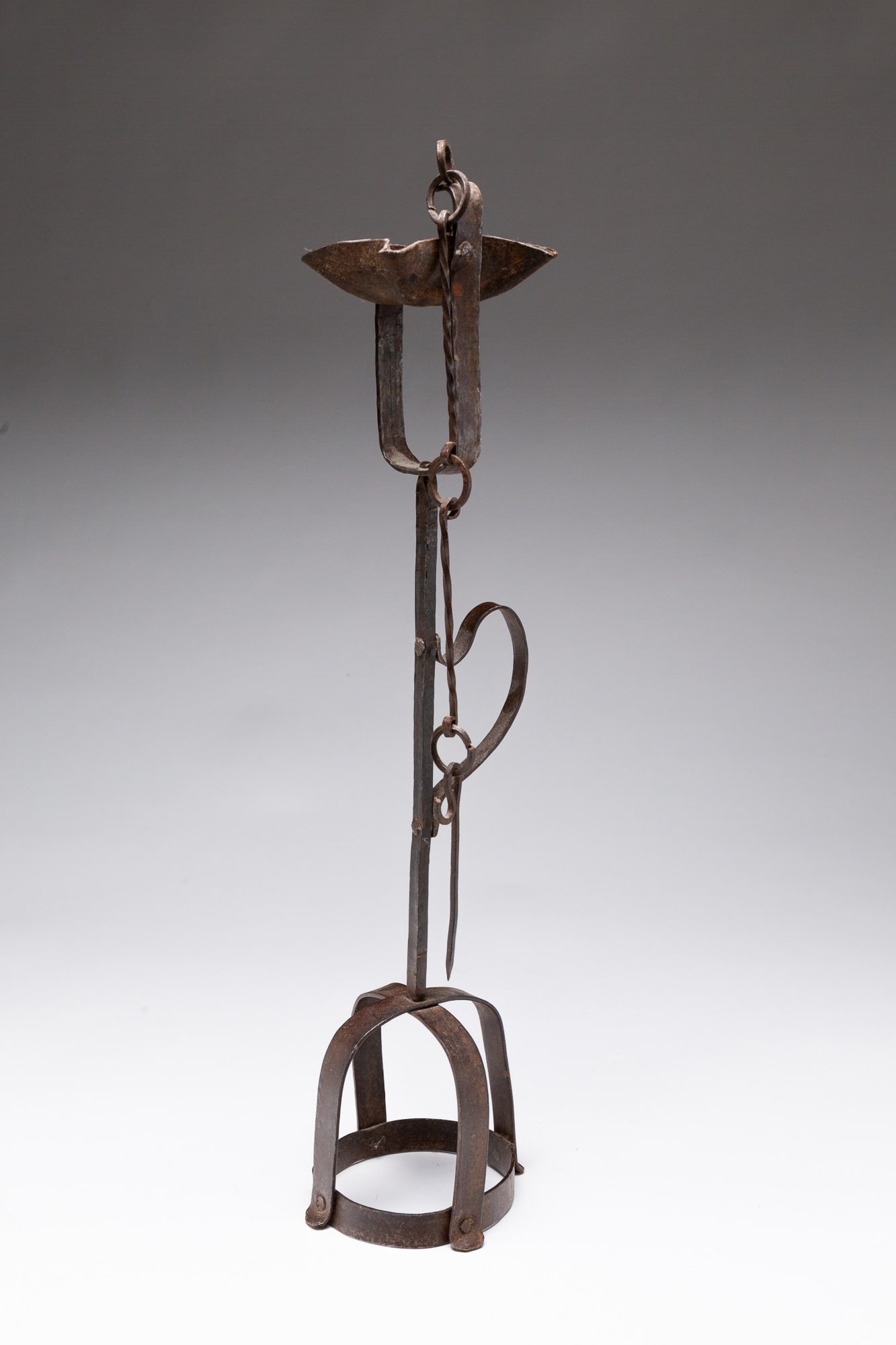 EARLY AND UNUSUAL GREASE LAMP ON CROWN-FORM MOUNTING BASE. (1 of 3)