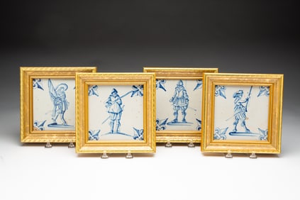 FOUR FRAMED MATCHING DELFT TILES.