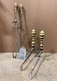 A PAIR OF ANDIRONS AND TWO MATCHING TOOLS.