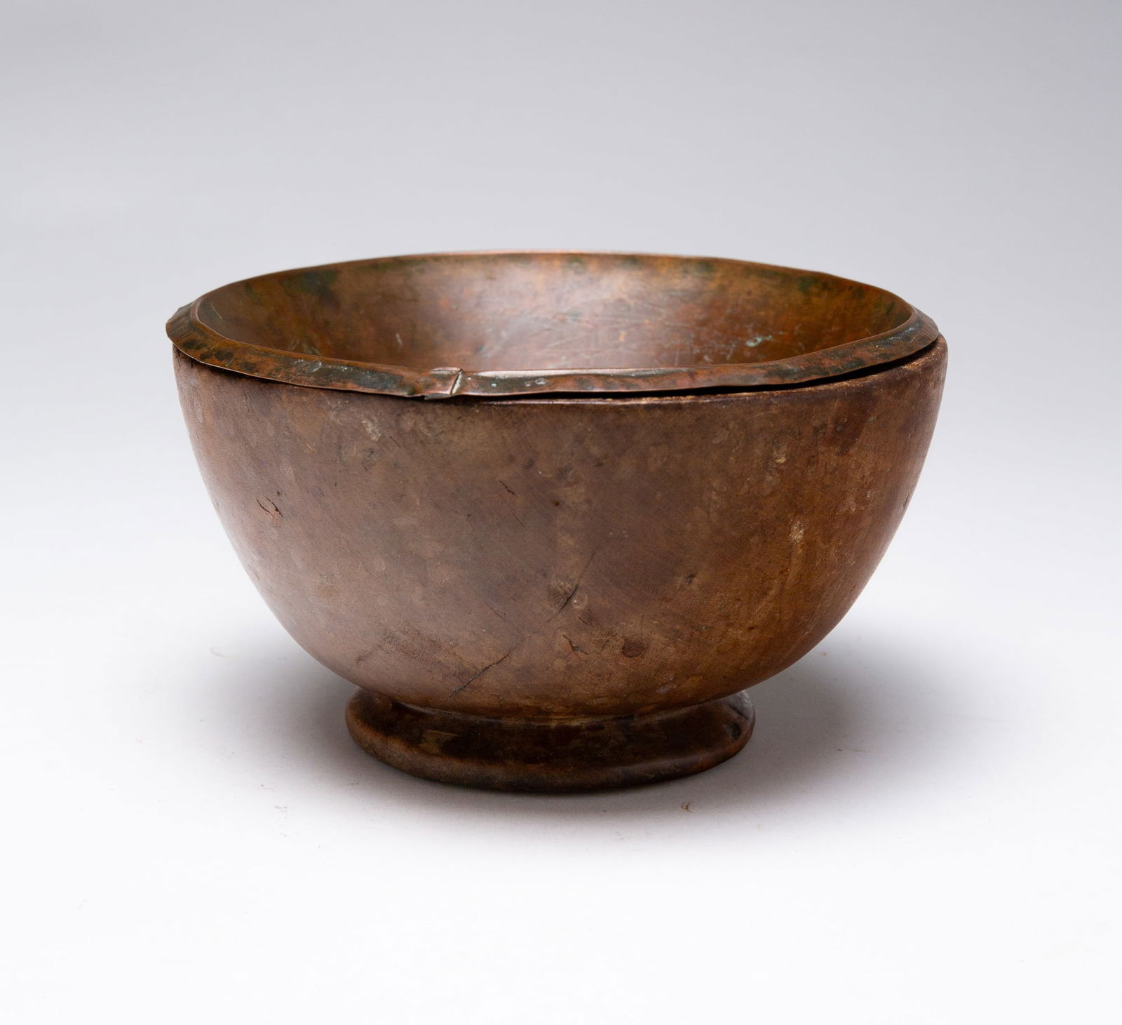 EARLY DIMINUTIVE TREEN FOOTED BOWL WITH COPPER LINER.: American, 19th Century. Maple. Approximately 3.75"h. From The Lifetime Collection of Mike & Marti Korba (Russiaville, Indiana).