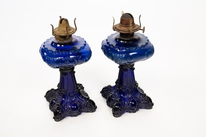 NEAR PAIR COBALT BLUE GLASS OIL LAMPS.