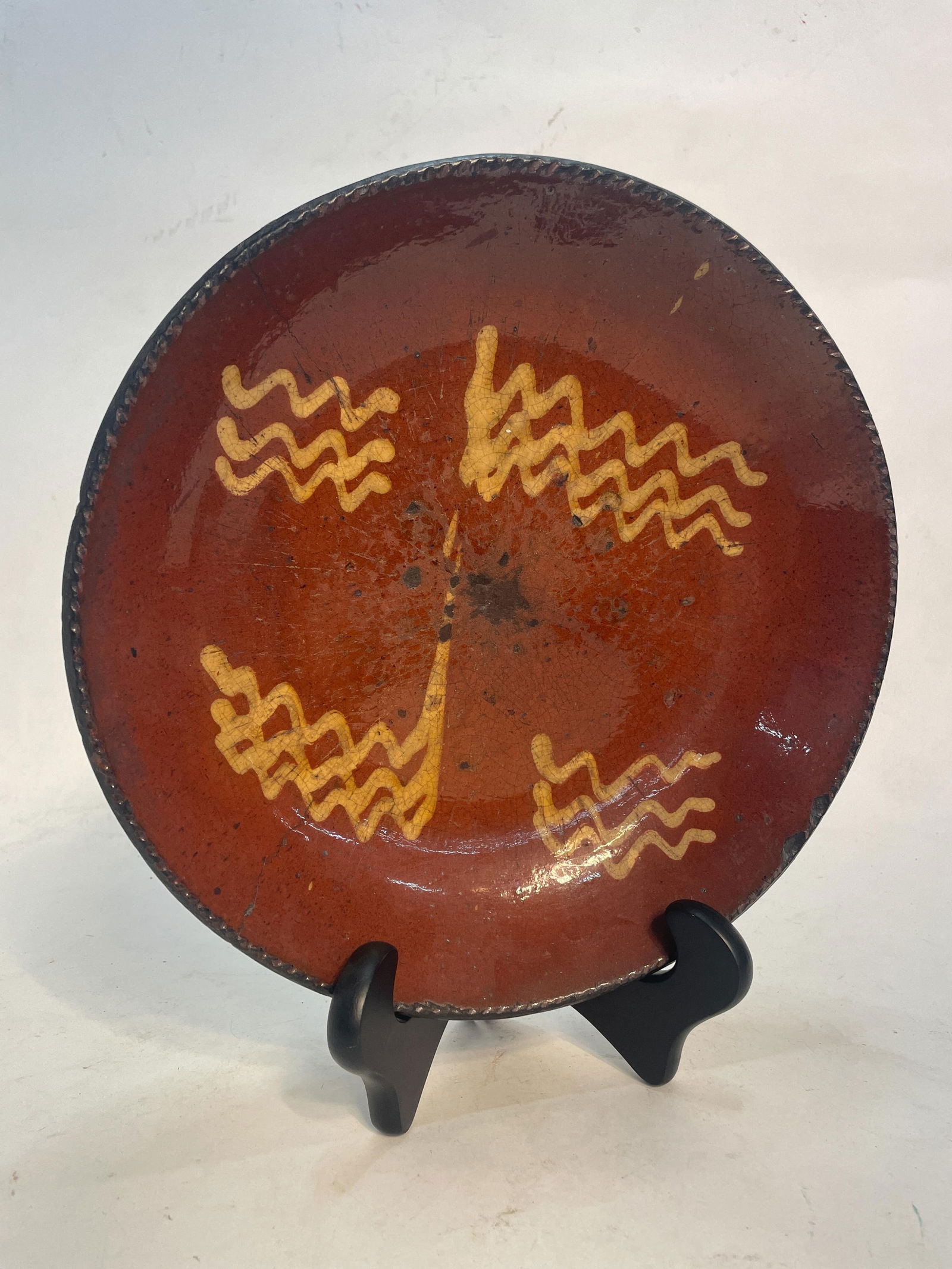 SLIP DECORATED REDWARE CHARGER. (1 of 5)