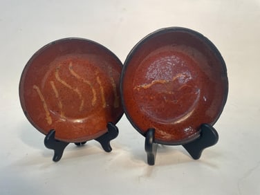 SLIP DECORATED REDWARE SHALLOW BOWLS.