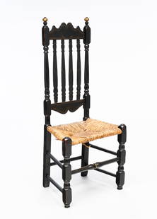 AMERICAN WILLIAM AND MARY EBONIZED AND PARCEL-GILT BANISTER-BACK SIDE CHAIR.: American, 18th Century. Ebonized wood with gilt accents. Ball finials, turned stiles, front legs and rungs, half turned splats, and rush seat. 17" seat, 45"h.