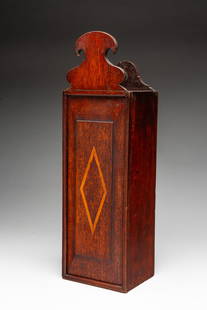 MAHOGANY AND LINE-INLAID SLIDE-LID HANGING PIPE BOX.: American or English, 19th Century. Mahogany with line inlay. Dovetailed and nailed case, sliding lid with applied crest and inlaid diamond. 18"h. 5.5"w.