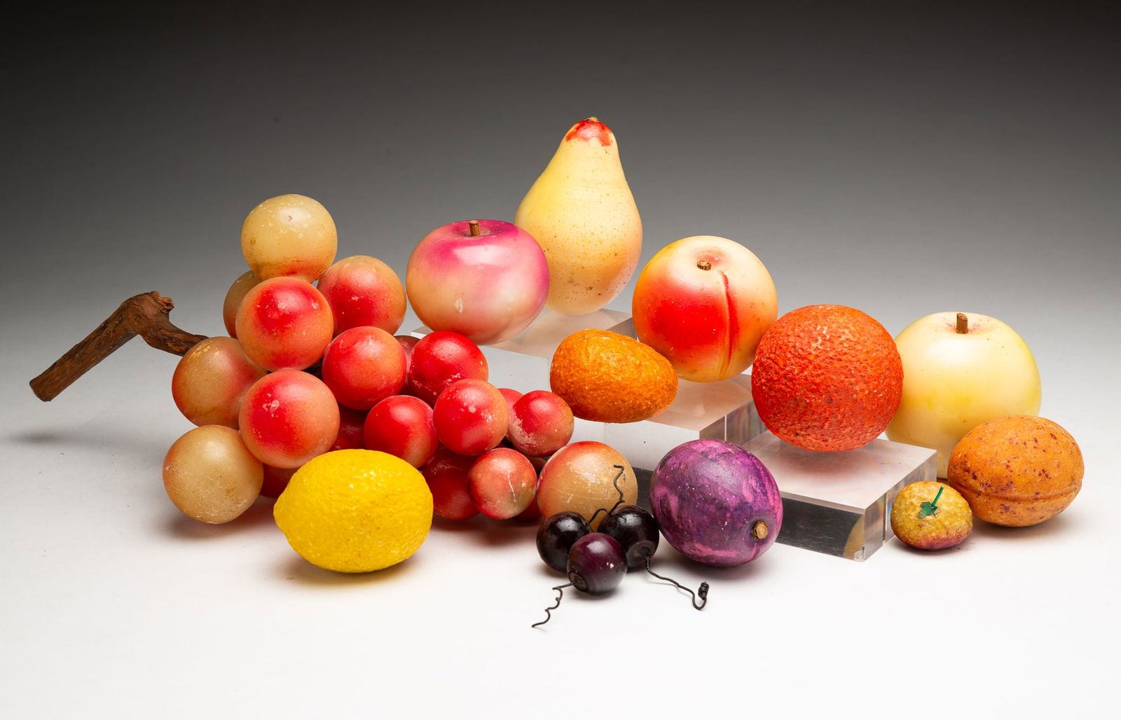 FOURTEEN PIECES OF CARVED AND PAINTED STONE FRUIT. (1 of 4)