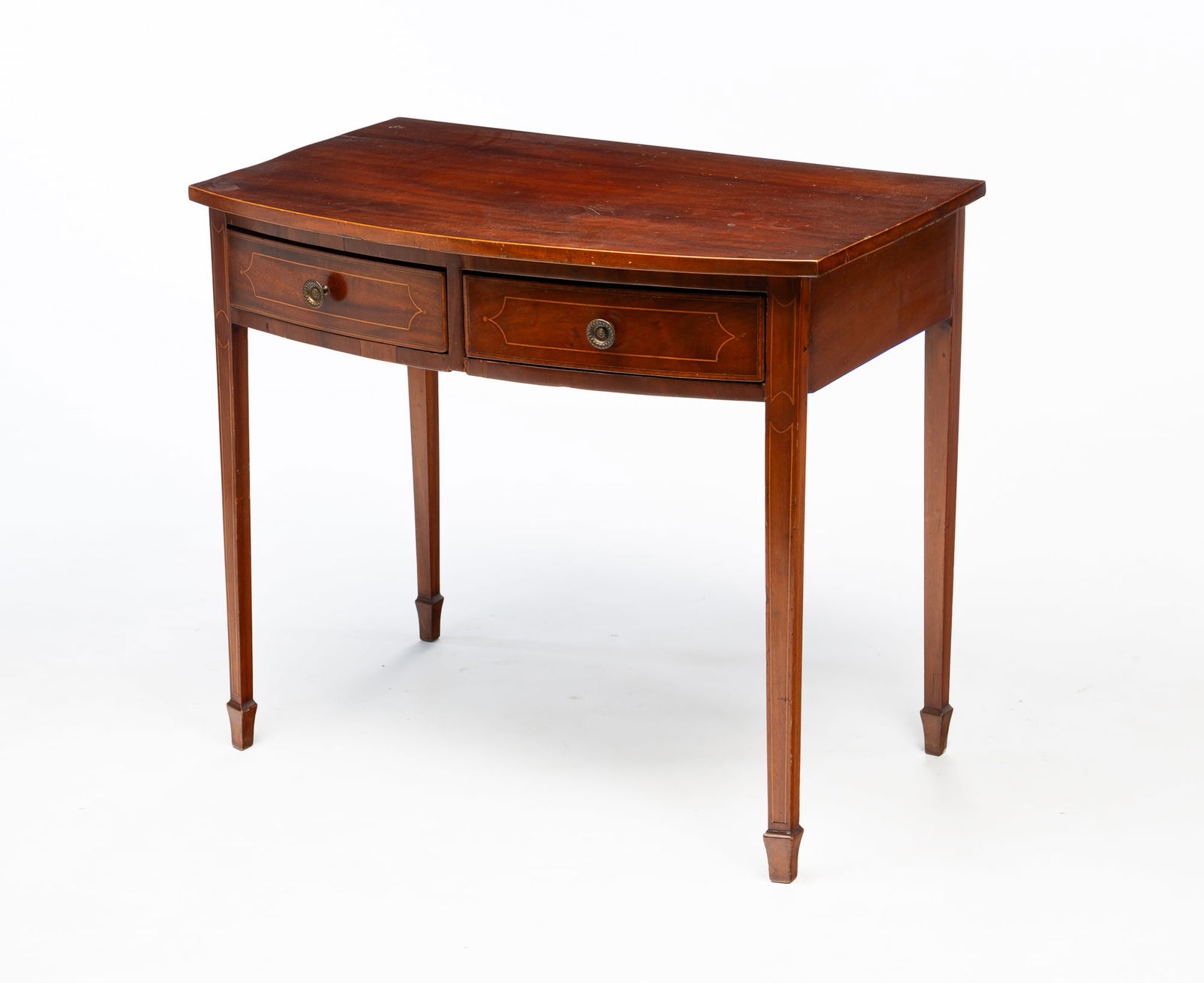 GEORGE III MAHOGANY AND STRING-INLAID BOWFRONT WRITING TABLE. (1 of 5)