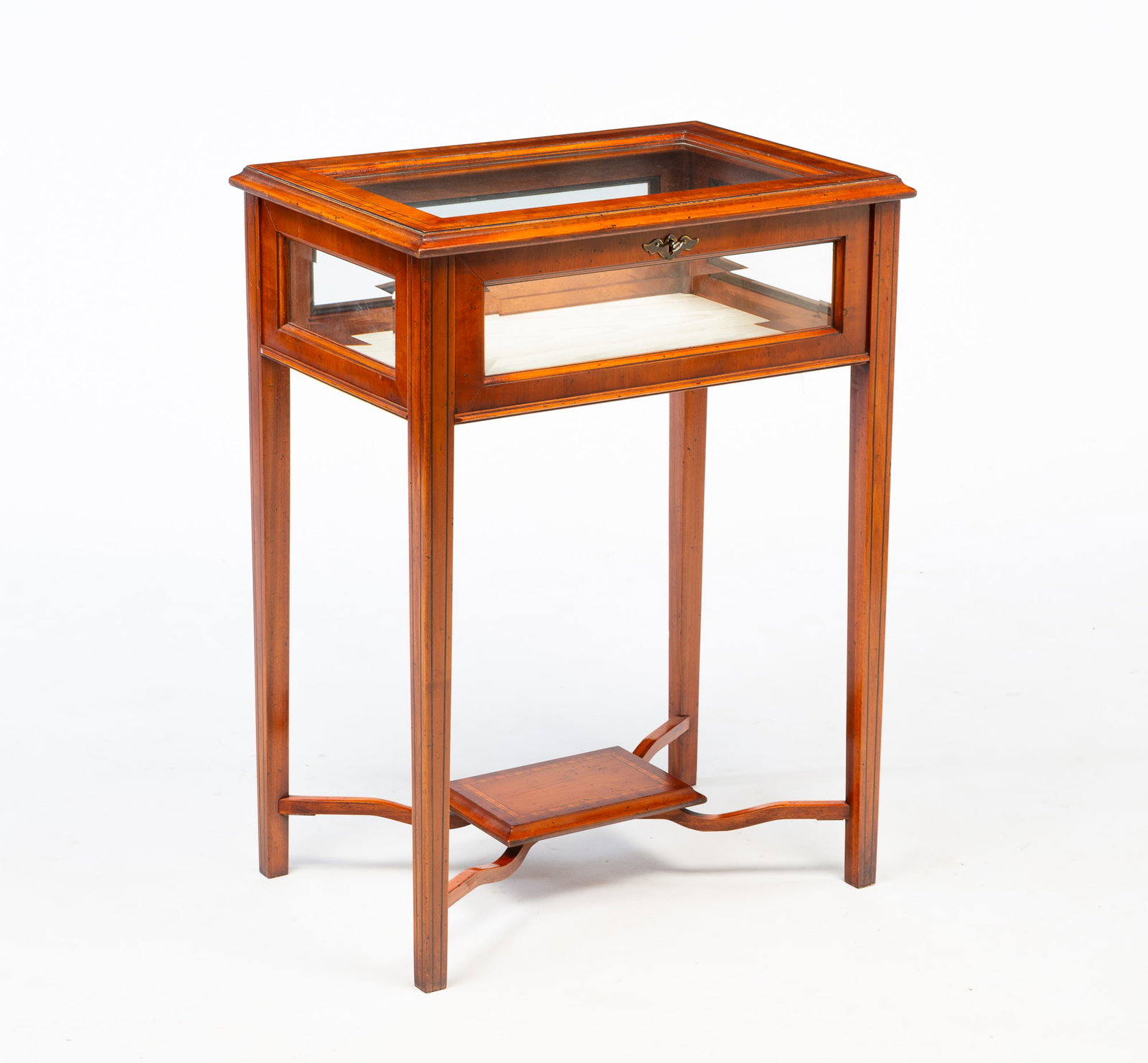 GEORGE III STYLE LINE-INLAID VITRINE TABLE.: Late 20th Century. Mixed woods. Banded and line inlays, slender tapered legs, lower shelf with shaped supports and beveled glass panes. 30"h. 22.25"w. 15.25"d.
