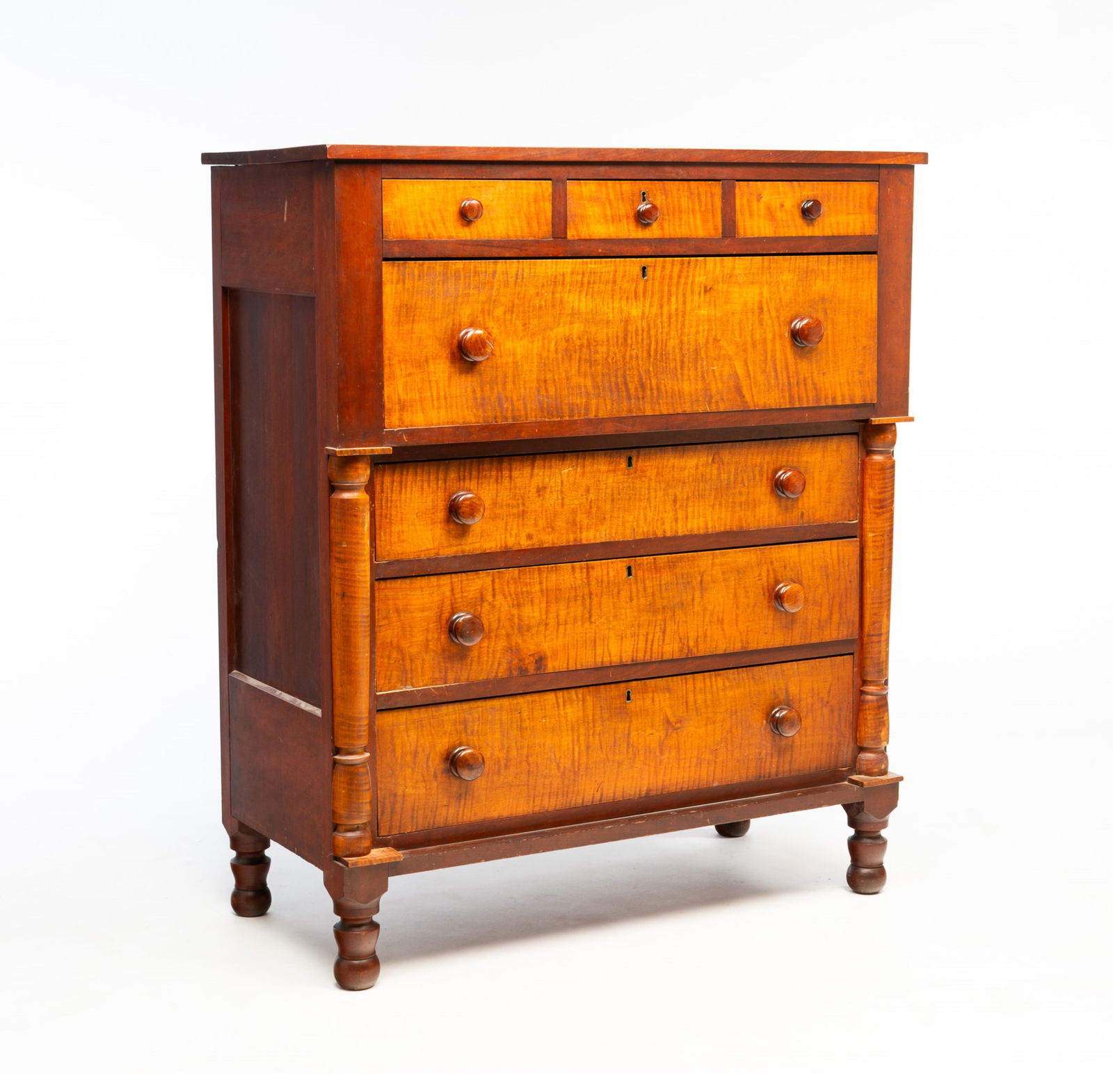 AMERICAN TRANSITIONAL TIGER MAPLE AND CHERRY SEVEN-DRAWER CHEST. (1 of 6)