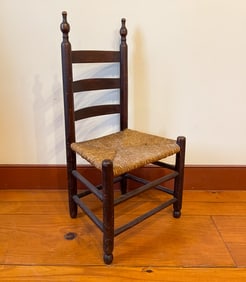 AMERICAN CHILD'S LADDERBACK SIDE CHAIR WITH RUSH SEAT.