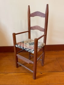 AMERICAN LADDERBACK CHILD'S ARMCHAIR WITH COVERLET-UPHOLSTERED SEAT.