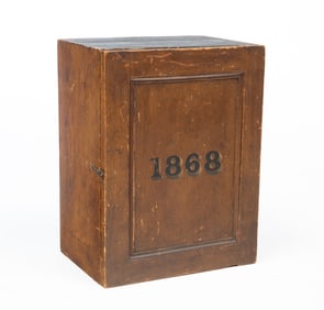 AMERICAN GRAIN-PAINTED PINE CABINET, DATED 1868.