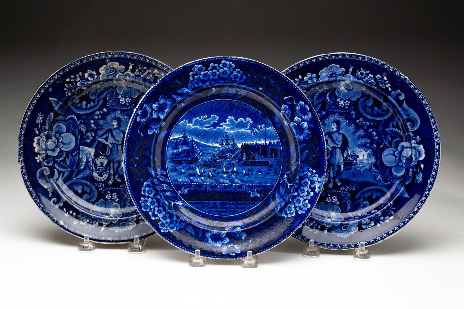 THREE CLEWS HISTORICAL BLUE STAFFORDSHIRE PLATES, INCL. "LANDING OF LAFAYETTE" AND "PEACE AND (1 of 6)