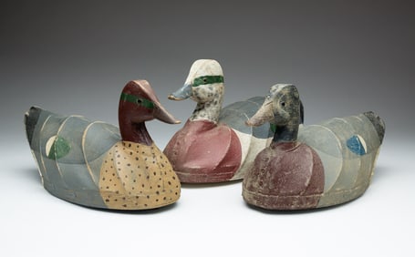 THREE WILLIAM MOSLEY (NORTH CAROLINA, 1925-2015) CARVED WOOD AND CANVAS-OVER-WIRE DUCK DECOYS.
