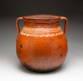 EUROPEAN GLAZED AND TOOLED EARTHENWARE DOUBLE-HANDLED JAR.