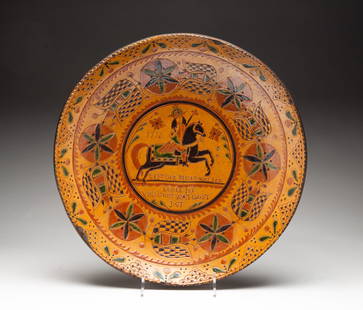 GREG SHOONER SLIP AND SGRAFFITO-DECORATED REDWARE PLATTER.: American (Warren County, Ohio), 2004. Large shallow platter with slip and sgraffito decoration including geometric shapes and figural motifs. Verso is stamped "Shooner / AMERICAN REDWARE" along with a