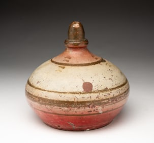 AMERICAN PAINTED RED CLAY DOORSTOP.