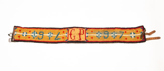 AMERICAN NEEDLEWORK BELT WITH LEATHER ACCENTS, DATED 1914 AND 1917.