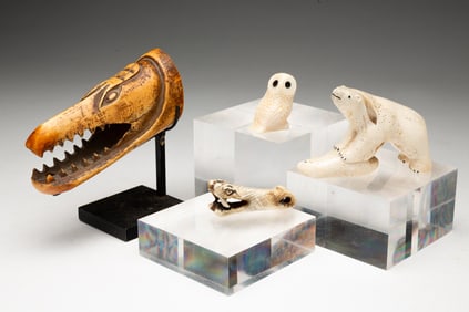 FOUR DIMUNITIVE INUIT CARVINGS.