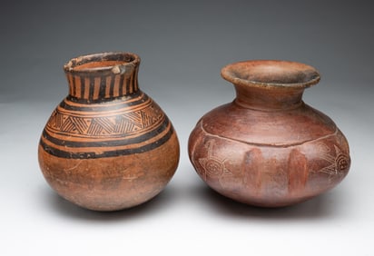 TWO DECORATED EARTHENWARE JARS.