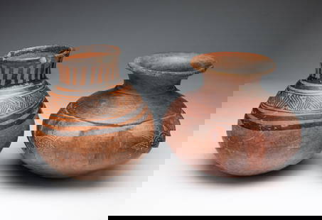 TWO DECORATED EARTHENWARE JARS.: Costa Rica, possibly Pre-Columbian. The first having vertical lines on tall neck and bands of horizontal stripes and diagonal lines with dots on shoulder of bulbous body. 7"h. 6"d. The second having a
