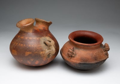 TWO DECORATED EARTHENWARE JARS.