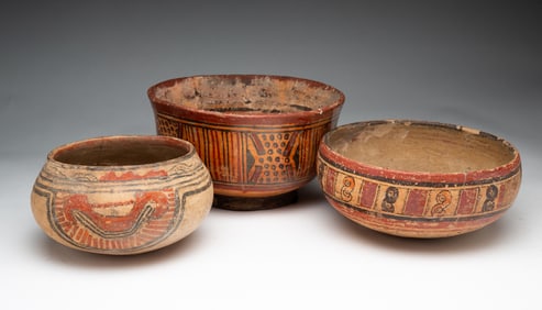 THREE DECORATED EARTHENWARE BOWLS.