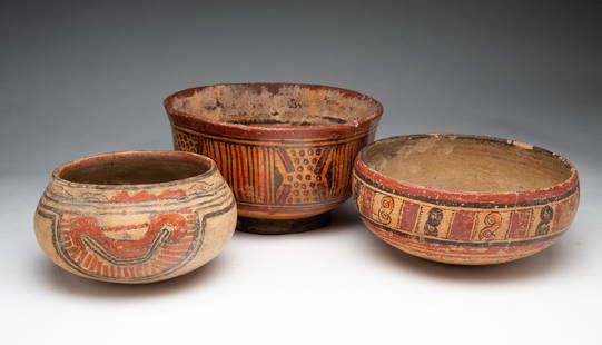 THREE DECORATED EARTHENWARE BOWLS.: Costa Rica, possibly Pre-Columbian. The first with red and black geometric designs on a tan ground. 3.5"h. 6"d. The second having red, orange, and black geometric and figure 8 designs and a suggestion