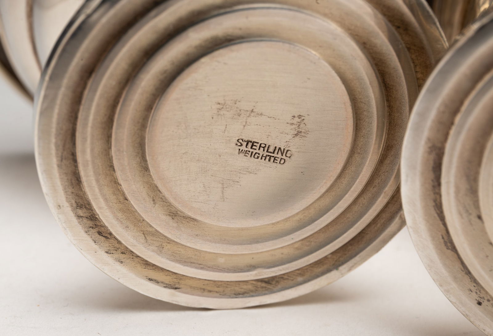 GROUP OF 27 WEIGHTED STERLING SILVER TABLE ACCESSORIES.: American 19th and 20th Centuries. Comprising a pair of Rogers bud vases, an Amston compote, a pair of LaPierre miniature salt and pepper shakers, a Towle pierced candleholder, six Towle polychrome ena