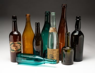 ASSEMBLED GROUP OF GLASS BOTTLES, INCL. EAGLE BOTTLING WORKS OF CINCINNATI.