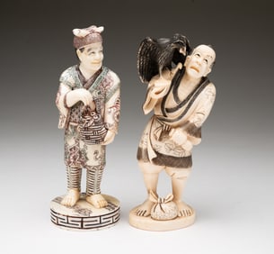 TWO STANDING MEN FIGURAL CARVINGS.