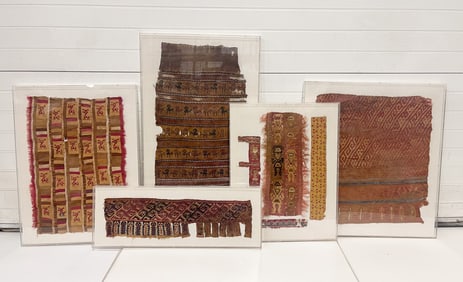 FIVE FRAMED TEXTILE FRAGMENTS.