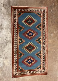 CAUCASIAN WOOL AREA RUG.