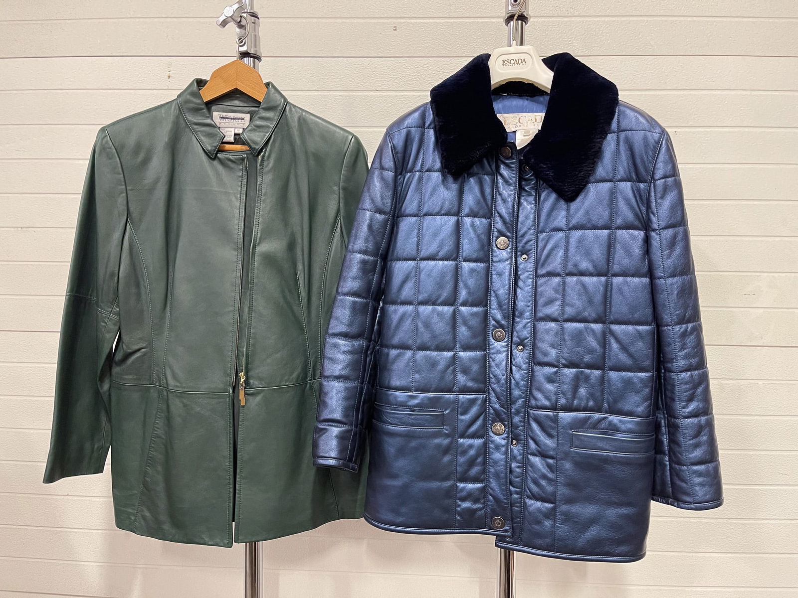 TWO FASHION COATS.: Contemporary. A Worth green leather jacket, zipper closure, and slit pockets, size 12. Together with a Escada by Margaretga Ley blue leather coat with sheared fur collar, pockets and button closure, s