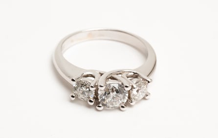 THREE - STONE DIAMOND RING.
