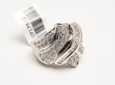 18K CHANNEL SET DIAMOND BYPASS BAND.
