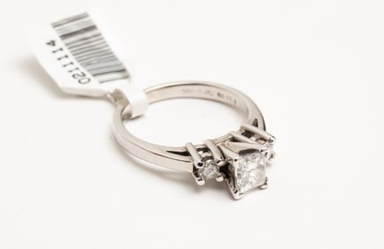 PLATINUM AND COBALT 3-STONE DIAMOND RING.