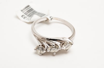 THREE STONE DIAMOND BYPASS RING.