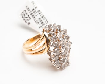 THREE ROW TIERED DIAMOND CLUSTER RING.