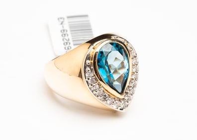 4.60 CARAT BLUE TOPAZ AND DIAMOND RING.
