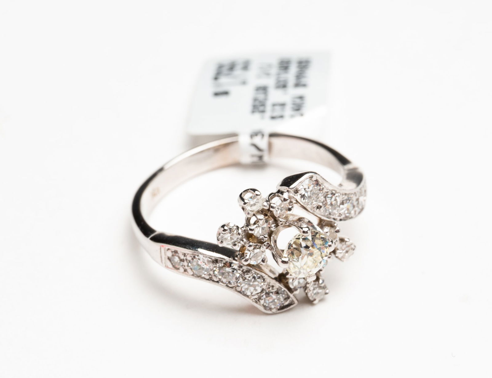 WHITE GOLD BYPASS RING WITH OLD EUROPEAN CUT DIAMOND. (1 of 2)