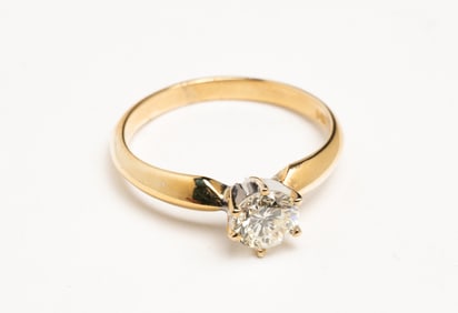 14 KARAT YELLOW DIAMOND SOLITAIRE RING.