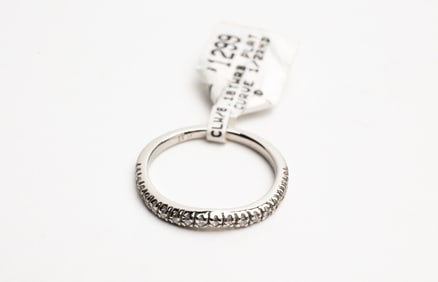 DELICATE PLATINUM AND DIAMOND HALF ETERNITY BAND.