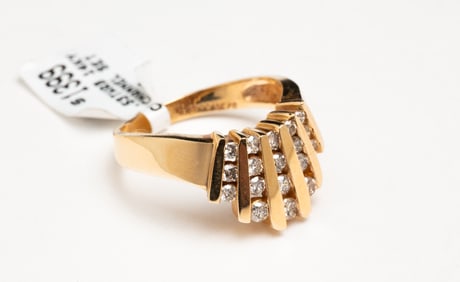 CHANNEL SET DIAMOND RING.