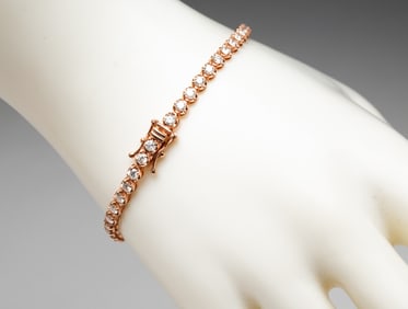 14K ROSE GOLD DIAMOND TENNIS BRACELET.